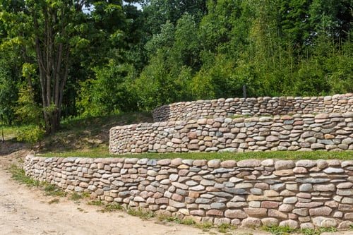 Retaining Walls on Sloped Lots: Why Drainage Decides Everything